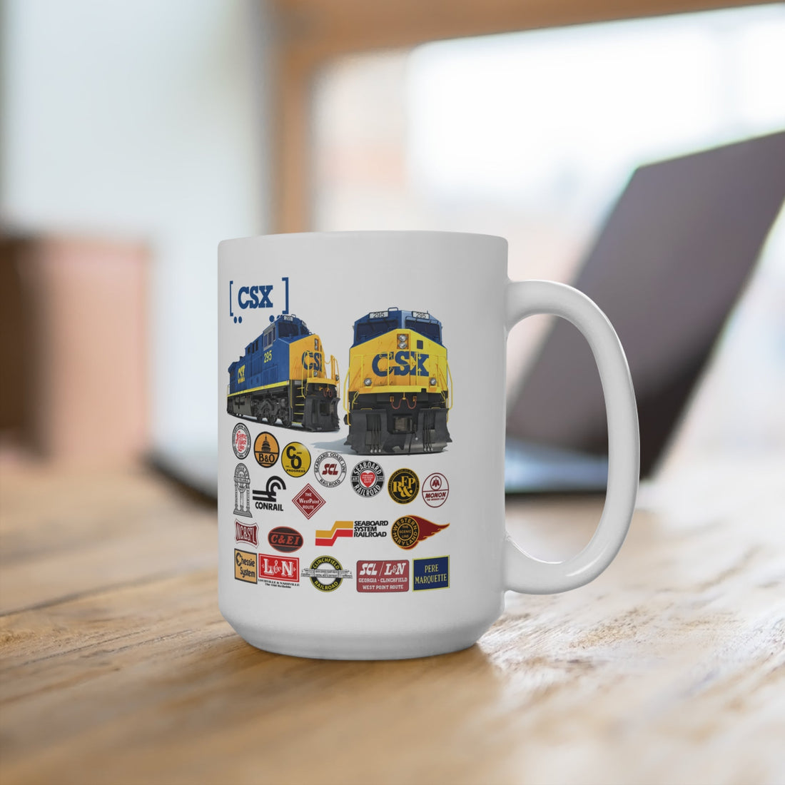 CSX Railroad Heritage Mug featuring two modern CSX locomotives and a collage of historic predecessor railroad logos including B&O, C&O, L&N, and Seaboard..
