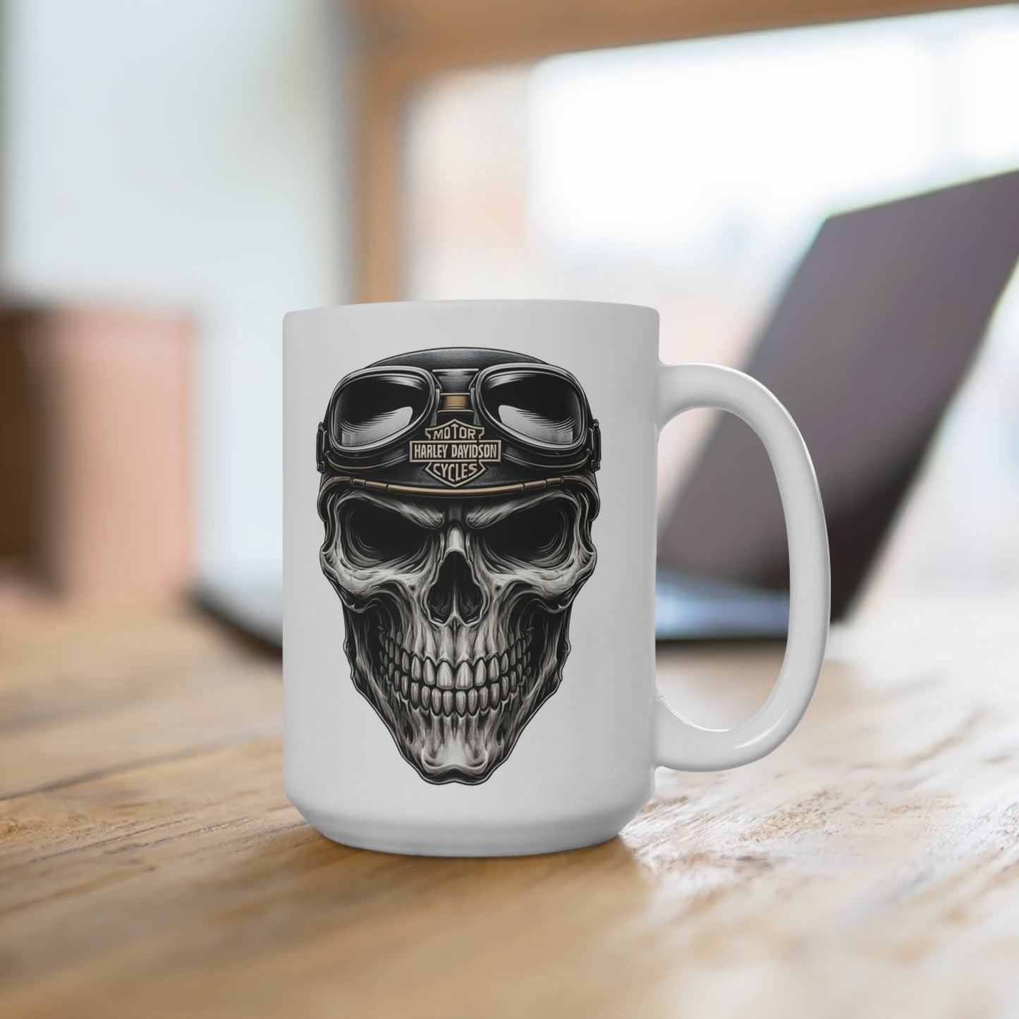 White mug with a skull design wearing goggles on a wooden surface.