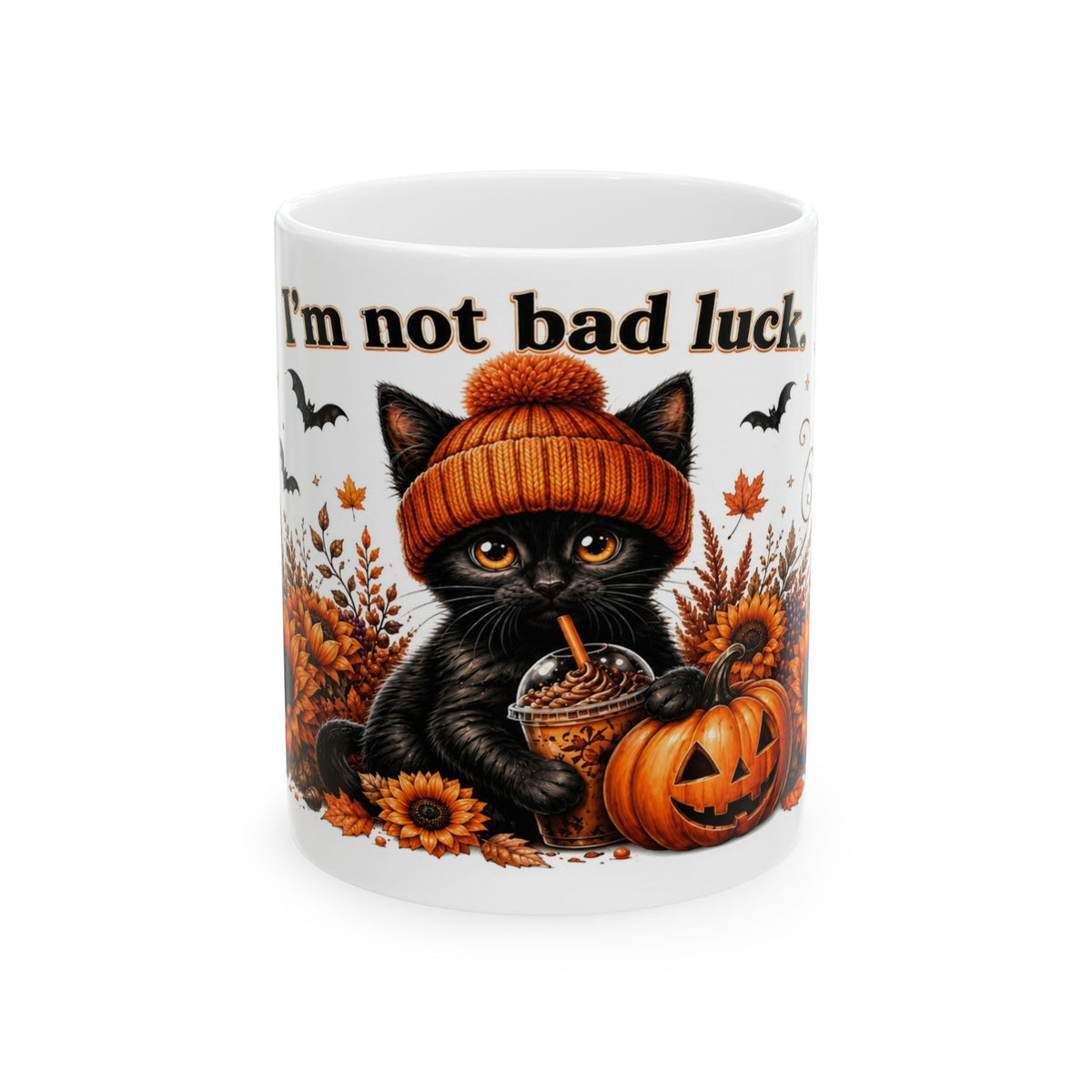 I’m not bad luck mug featuring a black kitten in an orange knit hat holding a drink beside a jack-o’-lantern and sunflowers.