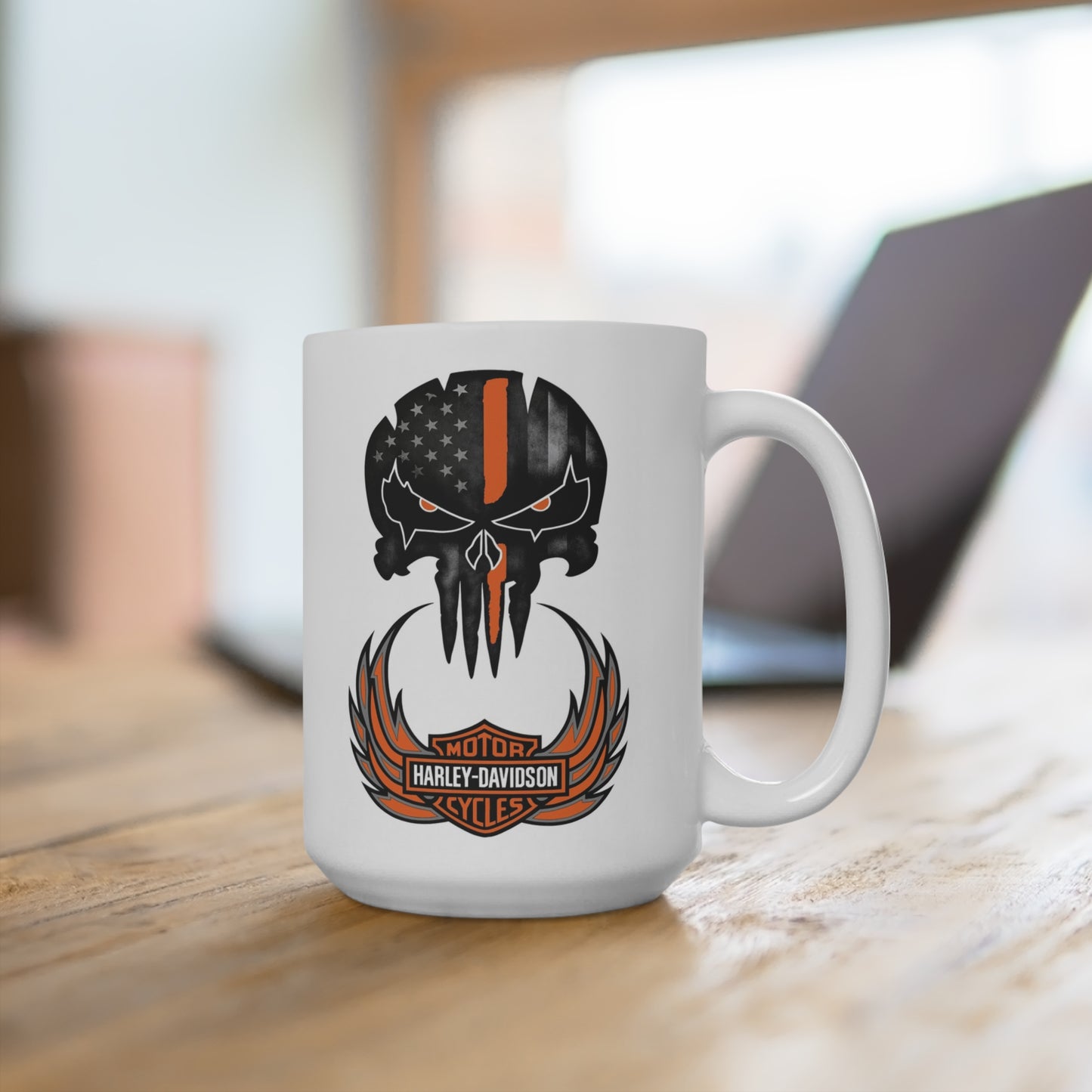 White mug with a black and orange logo on a wooden surface