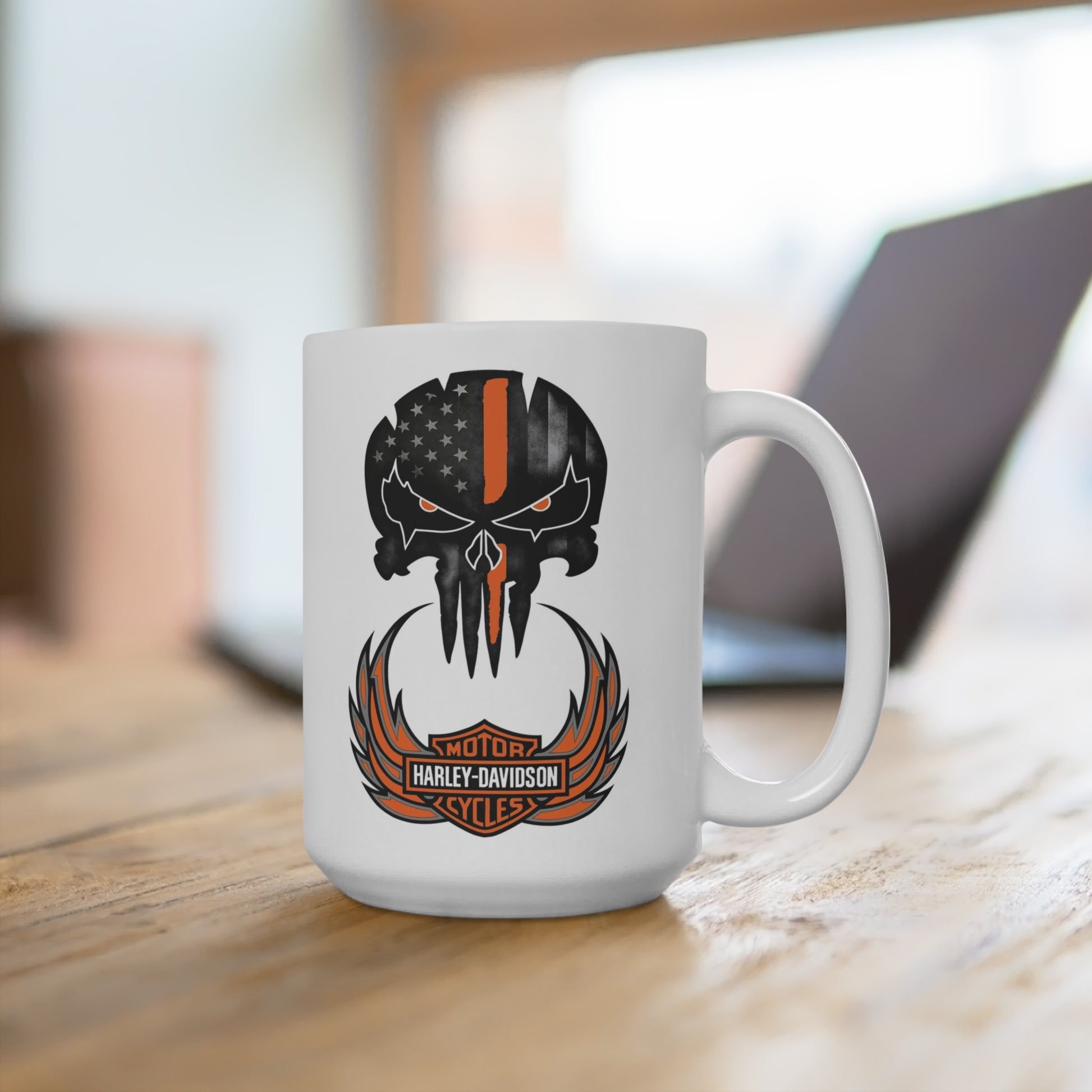 White mug with a black and orange logo on a wooden surface