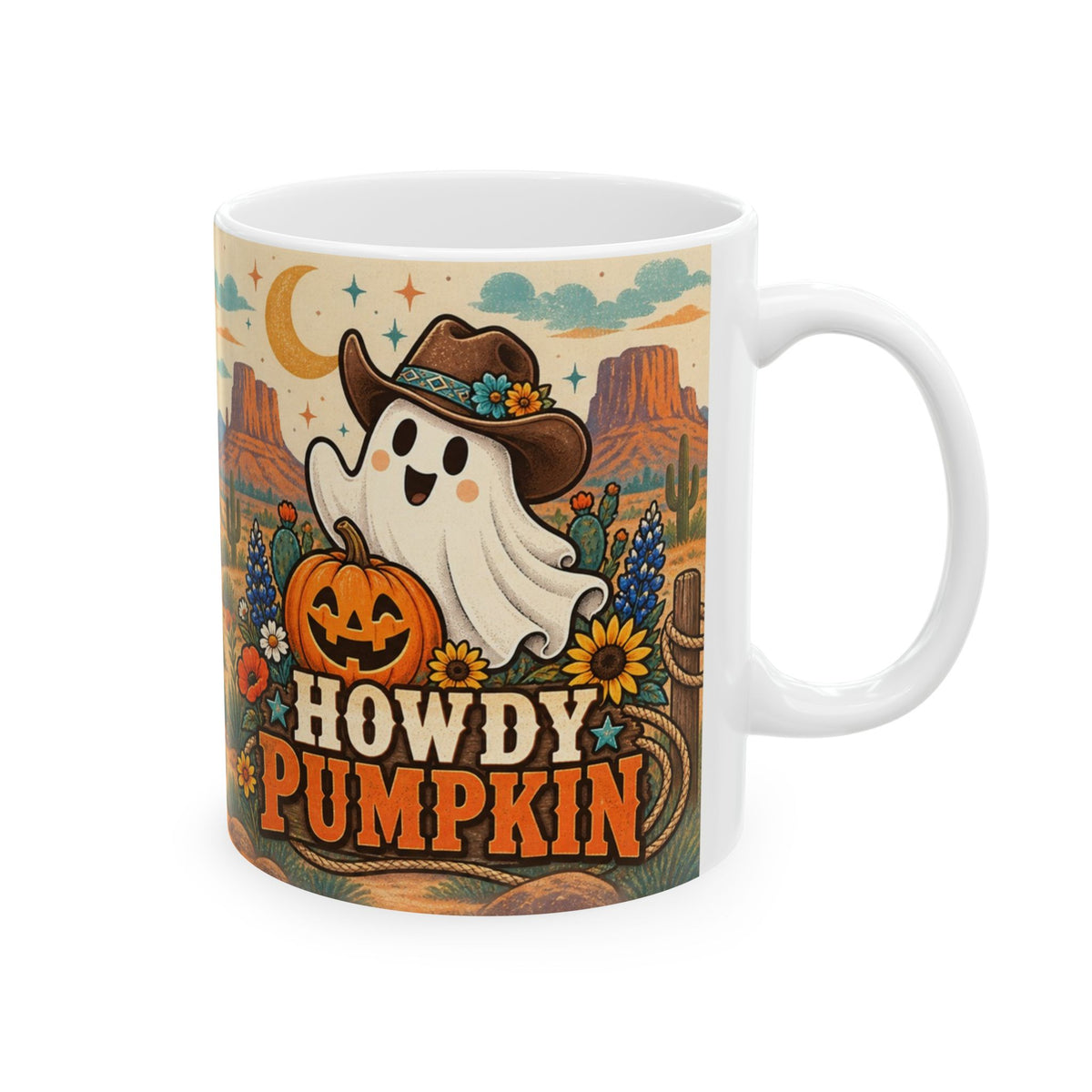A white ceramic mug featuring a colorful autumn-themed graphic with a ghost wearing a cowboy hat, a jack-o'-lantern, cactus, sunset mountains, and the text 'HOWDY PUMPKIN'.