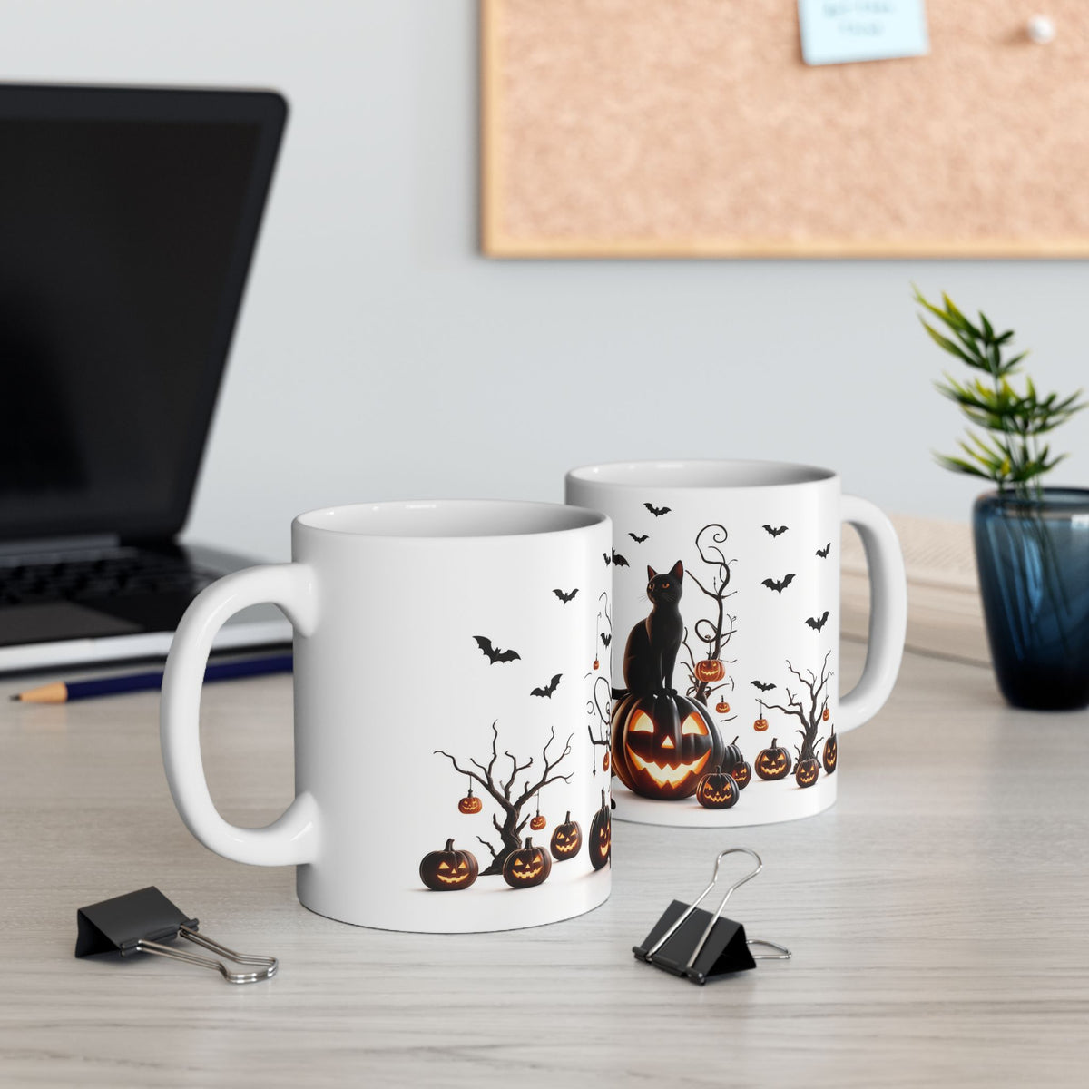 Left handle view of Halloween mug with pumpkin ornaments hanging from bare branches, jack-o’-lanterns, and bats.